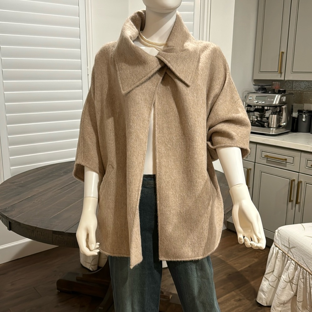 All alpaca brand . Made in Peru . One size . Ladies tan coat